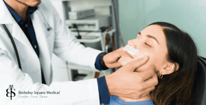 doctor checking patient after nose surgery